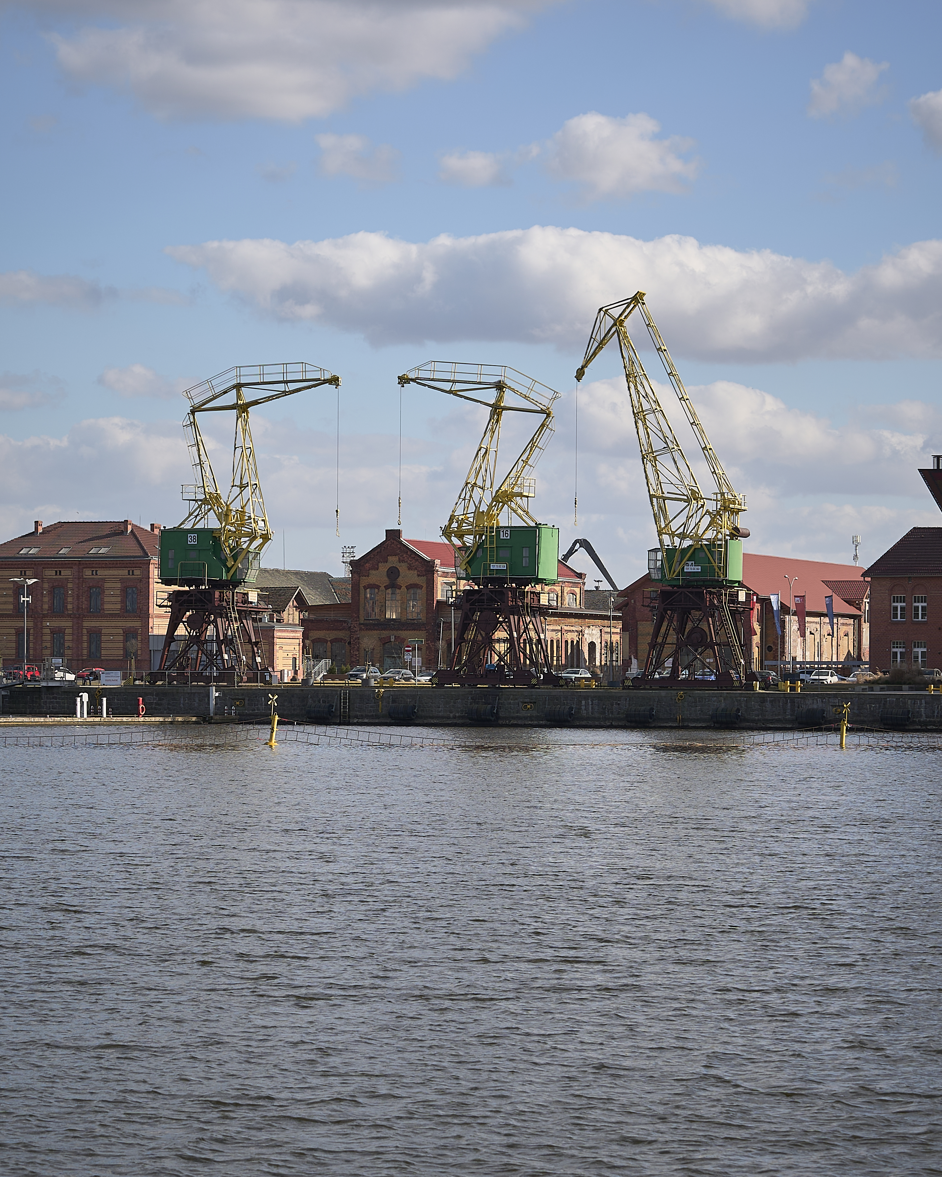 Sigma 20-200mm sample photo at 60mm showing detailed port cranes